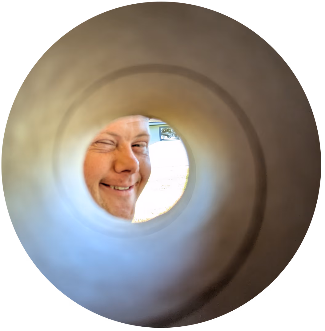 camper looking through a tube