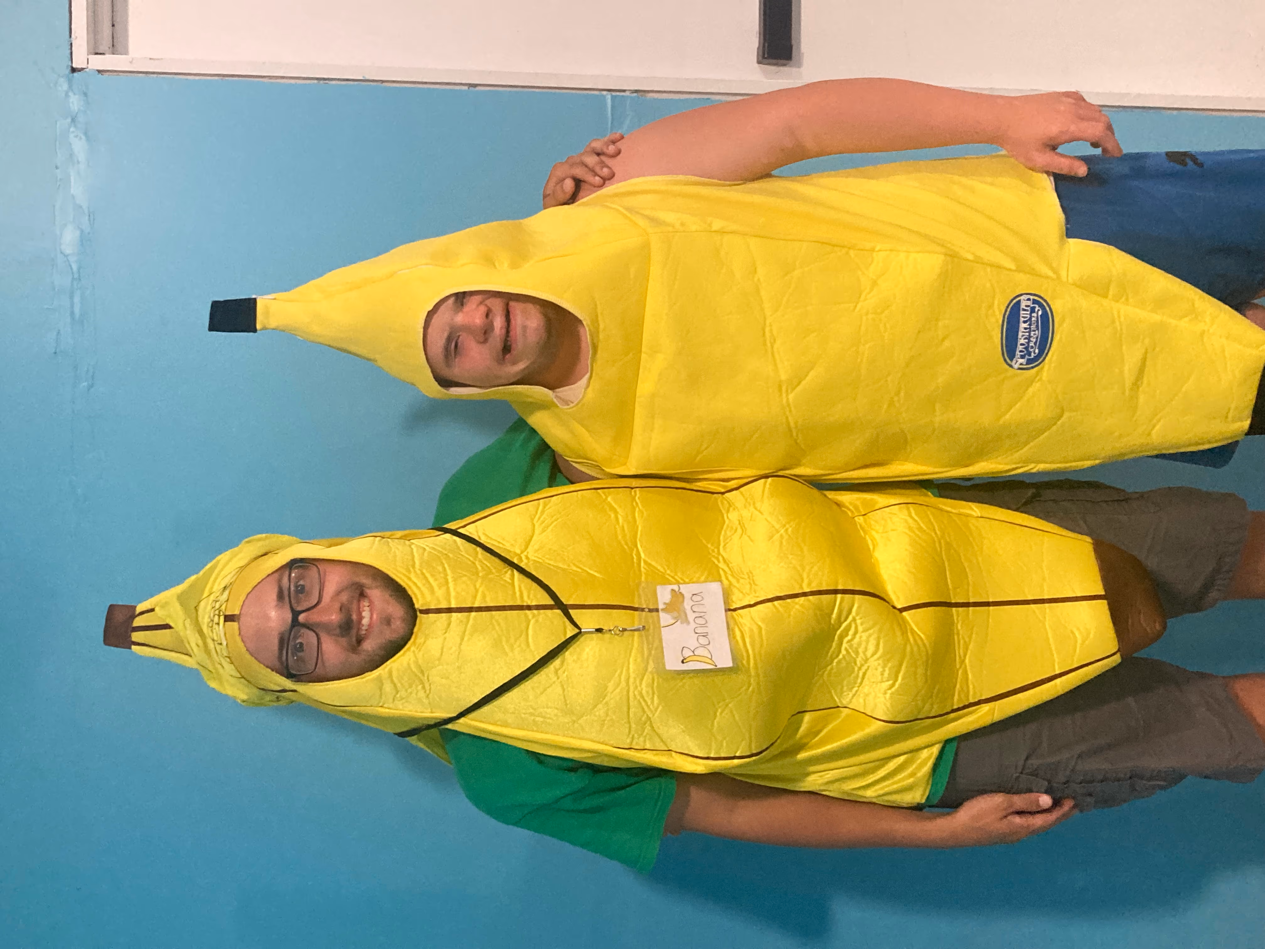 campers and counselors sitting around a campfire