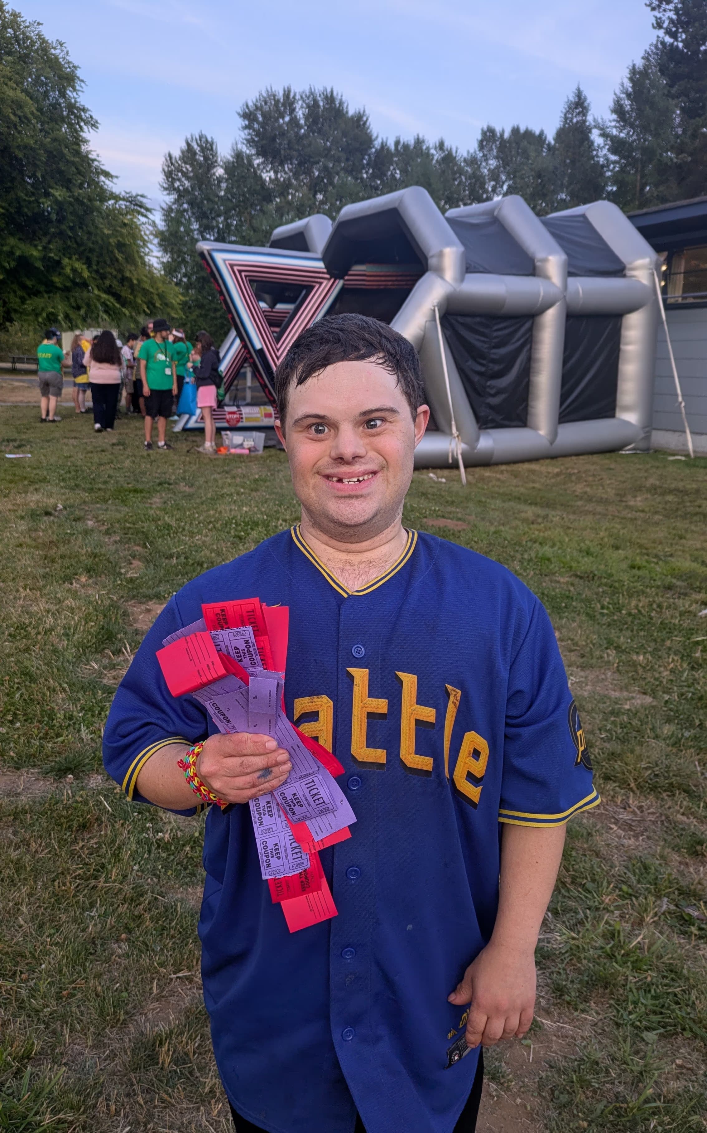 A camper at a carnival with lots of tickets