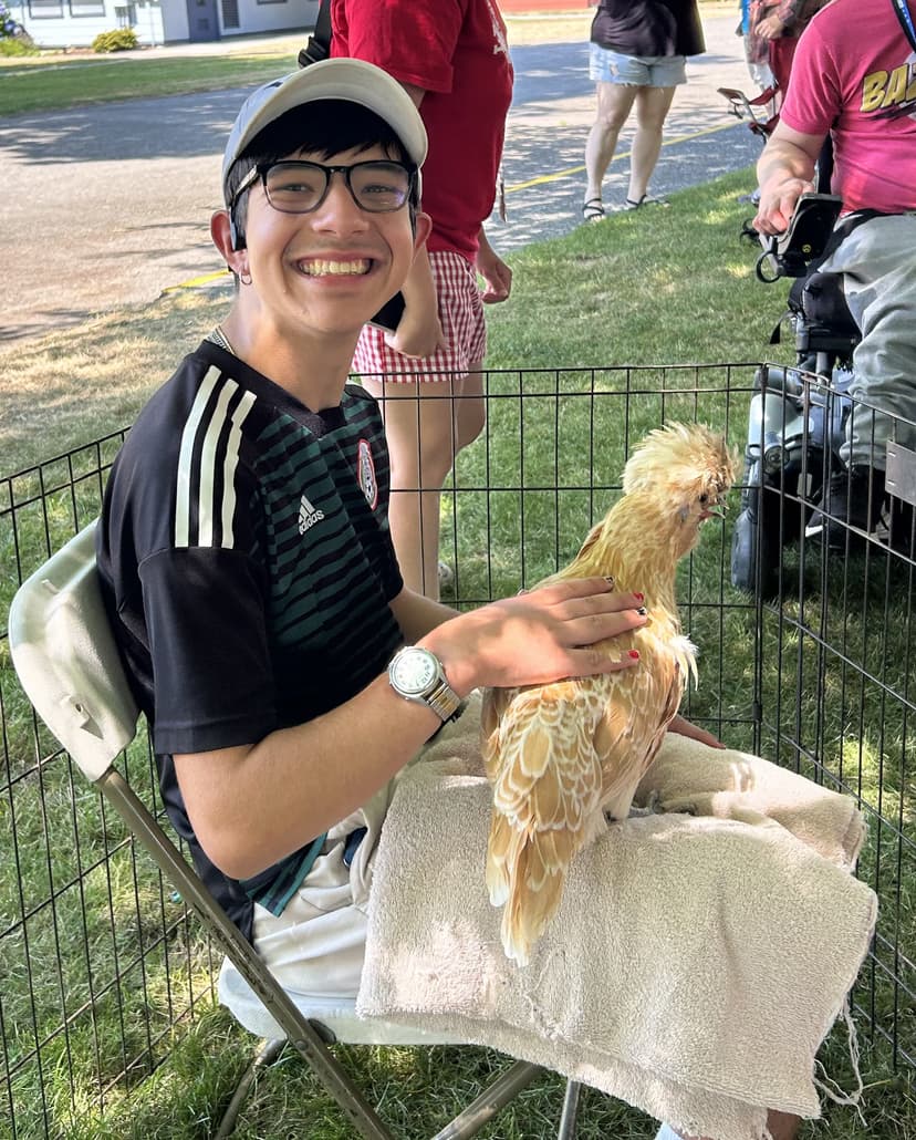a happy camper with a chicken