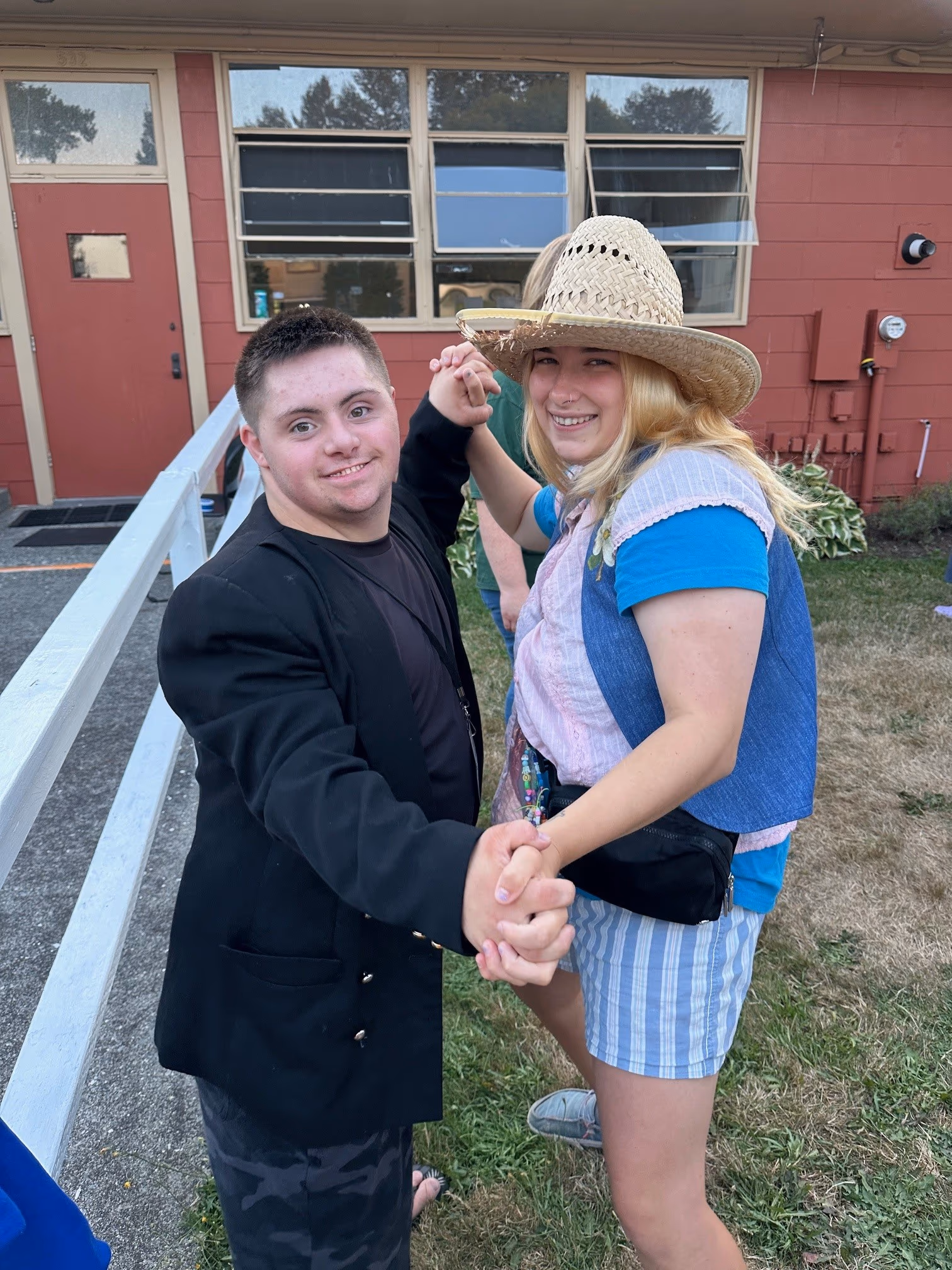 a camper dancing with a counselor